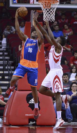 The Shanghai Sharks Guerschon Yabusele (16) shoots against the Houston Rockets Chinanu Onuaku (21) in the second half of an NBA basketball exhibition game Sunday, Oct. 2, 2016, in Houston. (AP Photo/George Bridges)